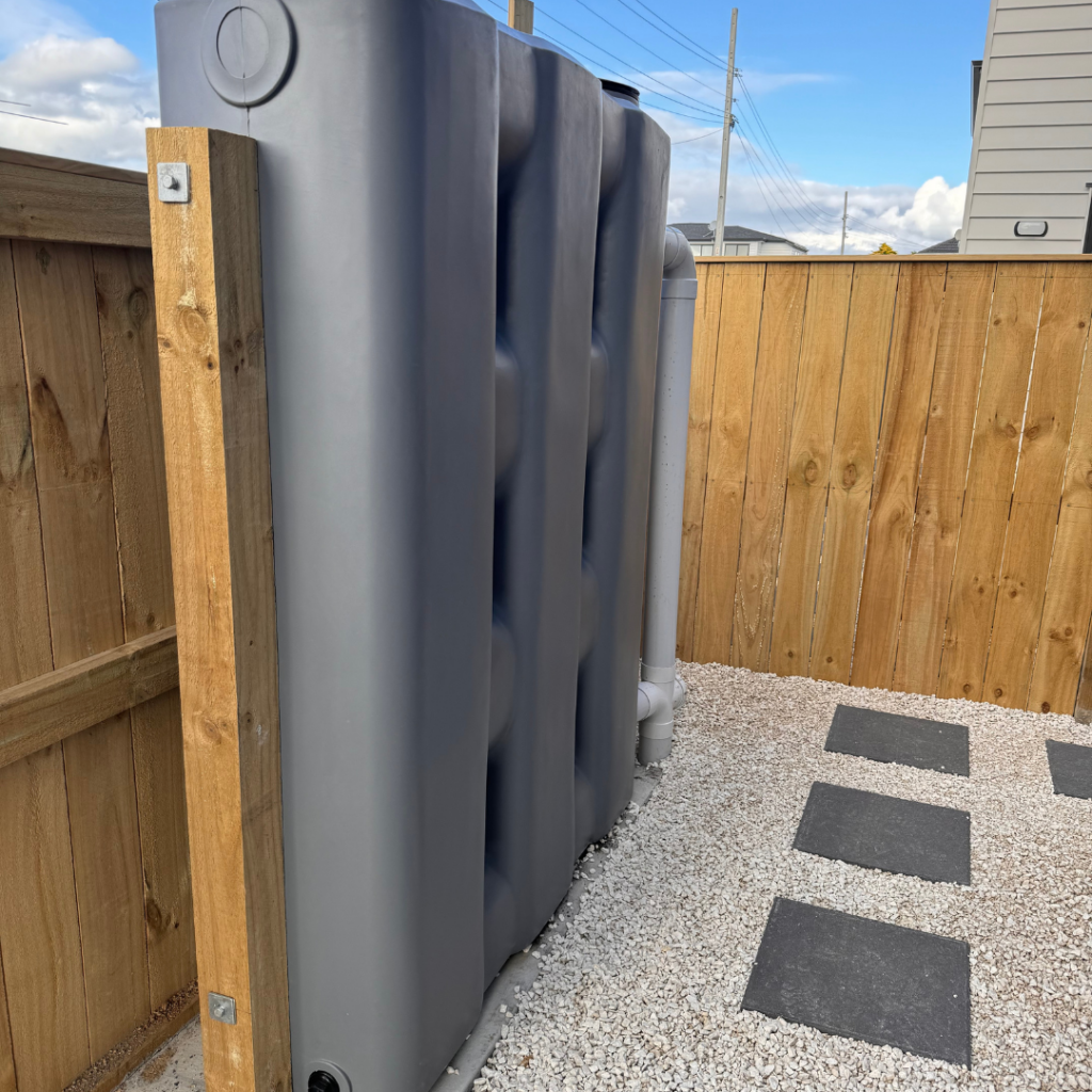 1000L Grey StormPANEL slimline rainwater tank installed by Just Tanks