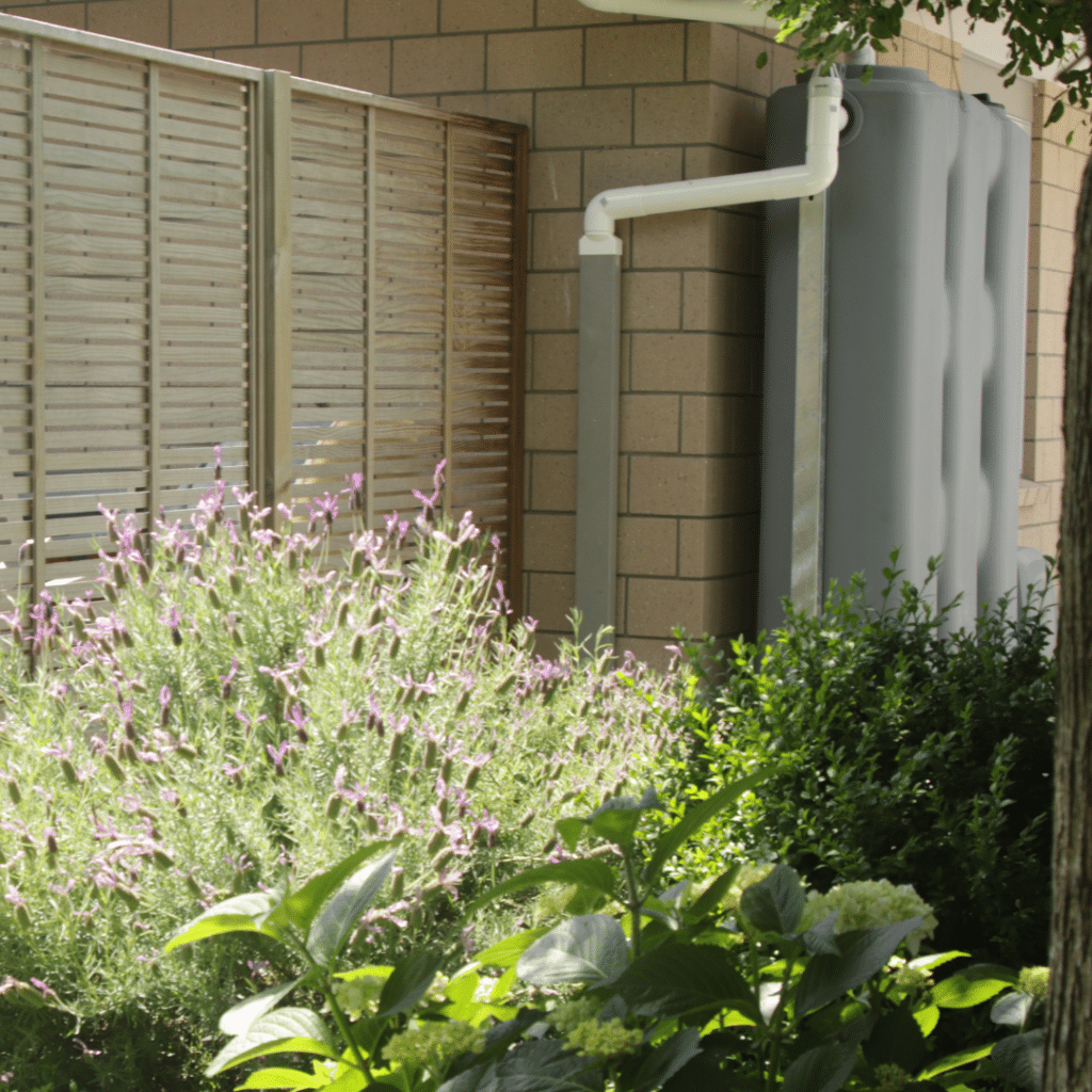 Light Grey StormPANEL slimline water tank system installed beside a home