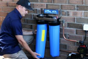 Residential water filtration system installed under a modern kitchen sink