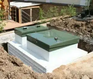 Below-ground tank system installation for efficient underground water storage and space-saving solution
