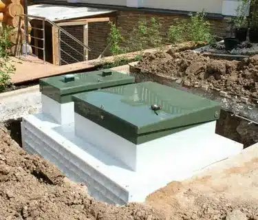 Below-ground tank system installation for efficient underground water storage and space-saving solution