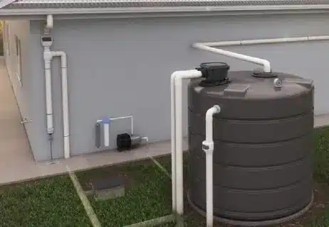 Rainwater harvesting nz system with rainwater tank at a New Zealand home