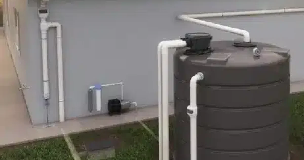Rainwater harvesting nz system with rainwater tank at a New Zealand home